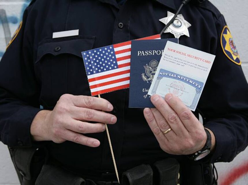 a police officer holding a flag and passport