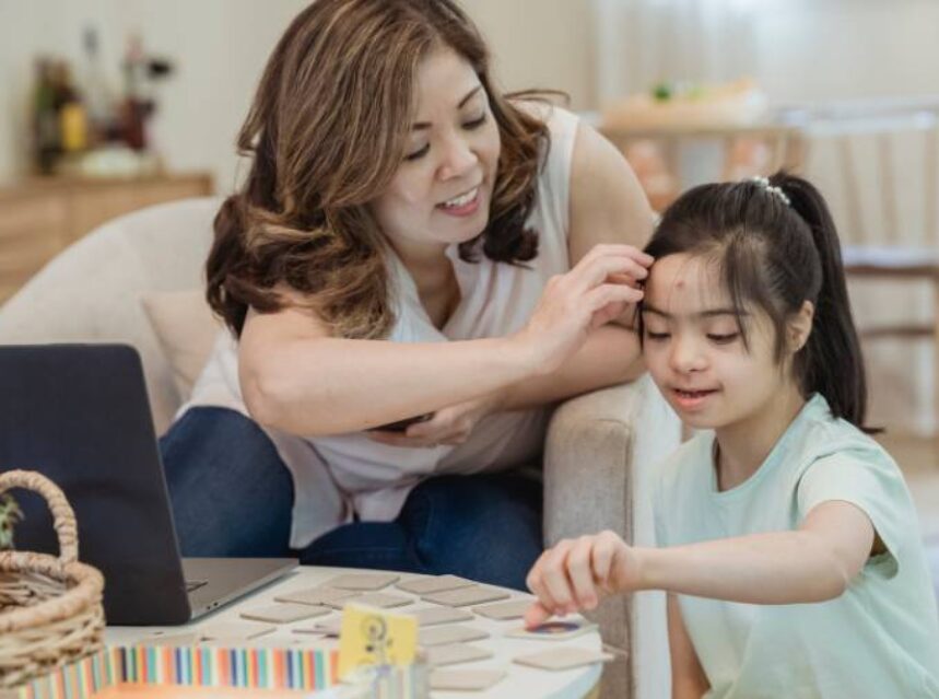 a woman touching a girl's forehead