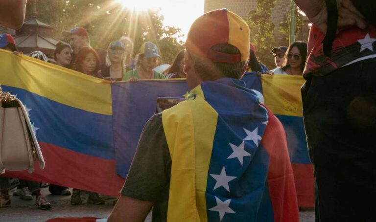 a group of people holding Venezuela flags