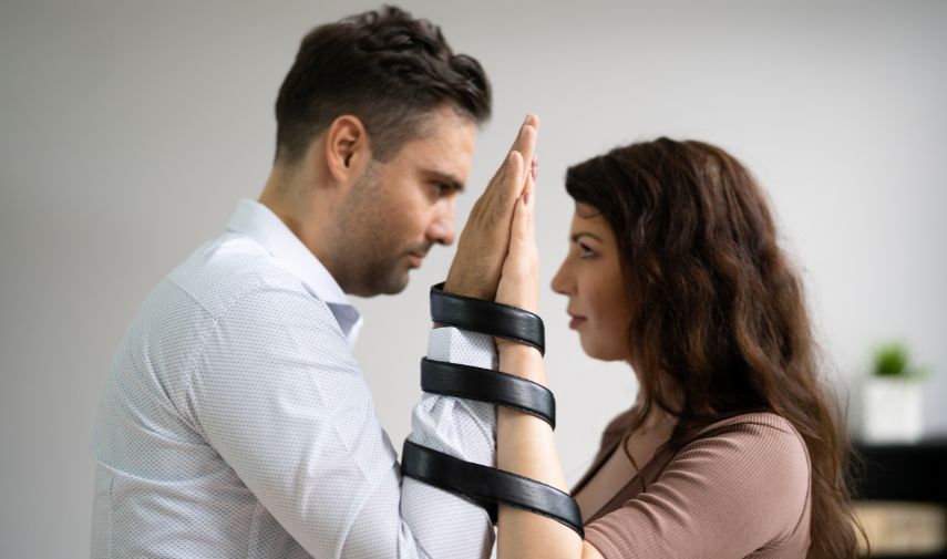 a man and woman holding hands together