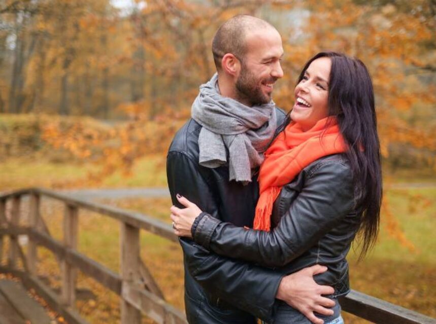 a man and woman hugging each other