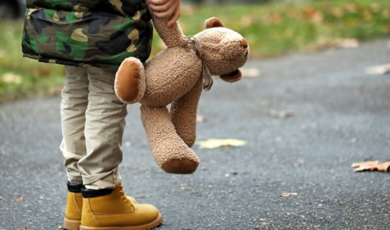 a child holding a teddy bear