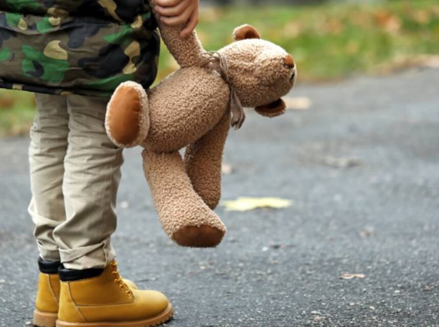 a child holding a teddy bear