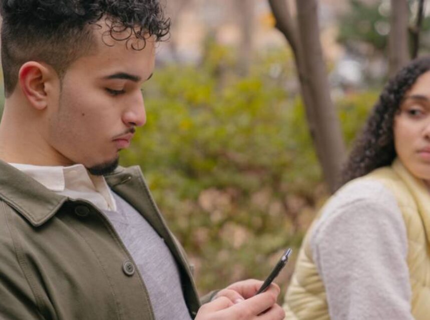 a man looking at a phone