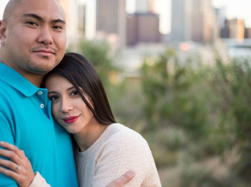 a man and woman posing for a picture